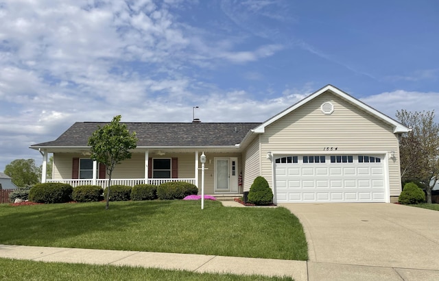 1554 Claudia Ln, Marysville, OH 43040 - ranch-style home featuring driveway, a porch, a front lawn, an attached garage, and roof with shingles