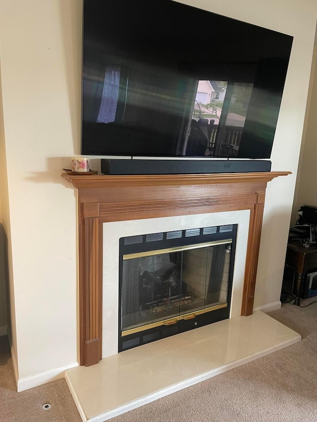1554 Claudia Ln, Marysville, OH 43040 - detailed view of a glass covered fireplace, carpet floors, and baseboards