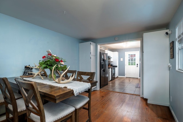 126 W S St, Hillsboro, OH 45133 - dining space with dark wood-style floors and baseboards