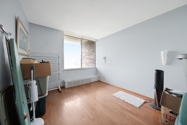 interior space featuring wood finished floors and radiator