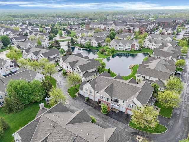 bird's eye view featuring a water view and a residential view