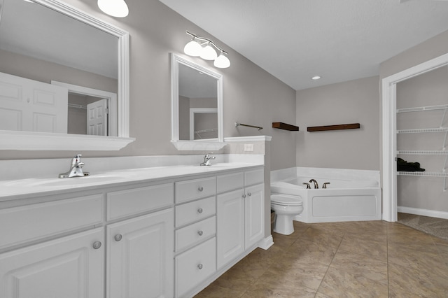full bathroom with a sink, a garden tub, and double vanity