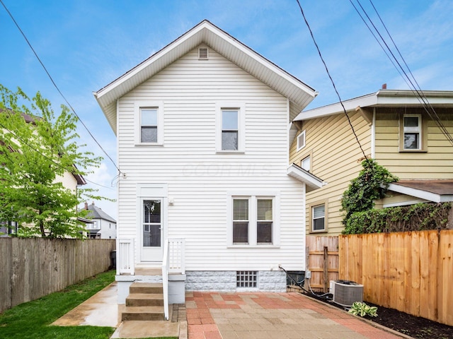 294 E Morrill Ave, Columbus, OH 43207 - back of property featuring a fenced backyard, central AC unit, and a patio area