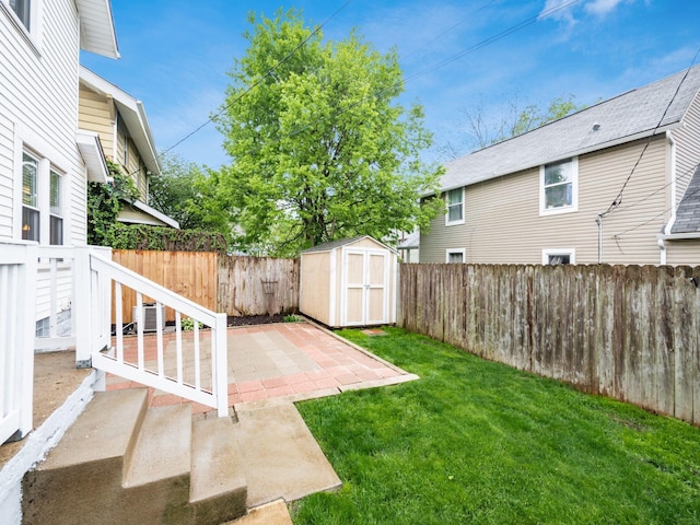 294 E Morrill Ave, Columbus, OH 43207 - view of yard featuring a storage shed, a patio area, and an outdoor structure