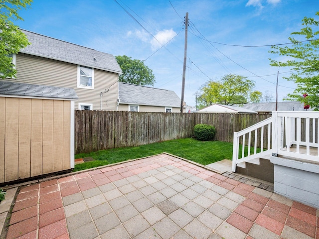 294 E Morrill Ave, Columbus, OH 43207 - view of patio with an outbuilding and a storage unit
