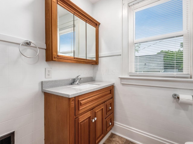 294 E Morrill Ave, Columbus, OH 43207 - bathroom featuring vanity and tile walls