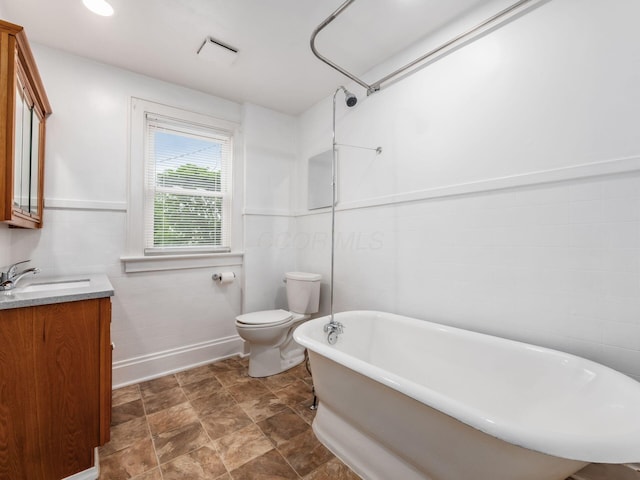 294 E Morrill Ave, Columbus, OH 43207 - full bath with a freestanding bath, vanity, toilet, and baseboards