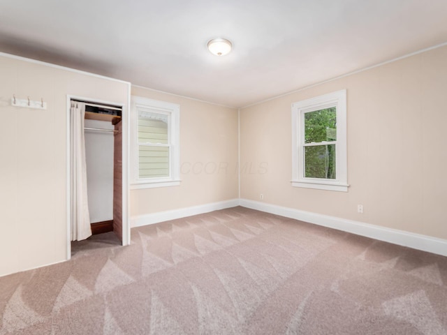 294 E Morrill Ave, Columbus, OH 43207 - unfurnished bedroom featuring carpet, baseboards, and a closet