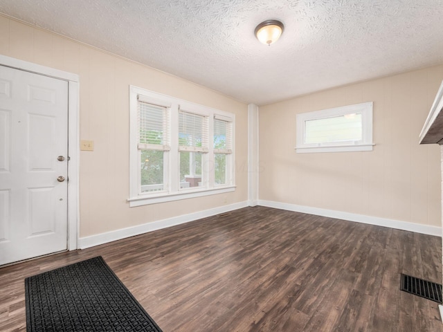 294 E Morrill Ave, Columbus, OH 43207 - entryway featuring dark wood-style flooring, baseboards, and a textured ceiling