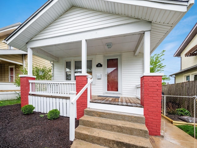 294 E Morrill Ave, Columbus, OH 43207 - view of exterior entry featuring covered porch and fence
