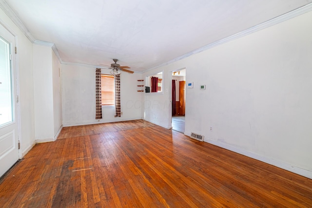247 Bank St, Mount Gilead, OH 43338 - unfurnished room with crown molding, visible vents, hardwood / wood-style floors, baseboards, and ceiling fan