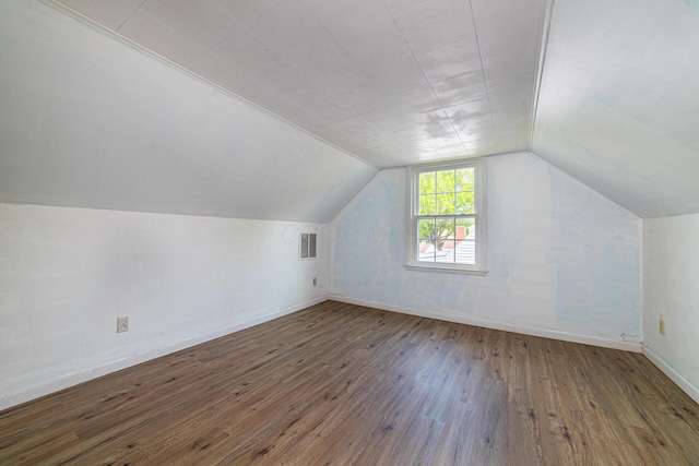 247 Bank St, Mount Gilead, OH 43338 - additional living space with baseboards, visible vents, lofted ceiling, and hardwood / wood-style floors