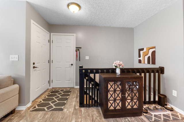 9137 Parkpoint Ln, Lewis Center, OH 43035 - entryway with wood finished floors, baseboards, and a textured ceiling