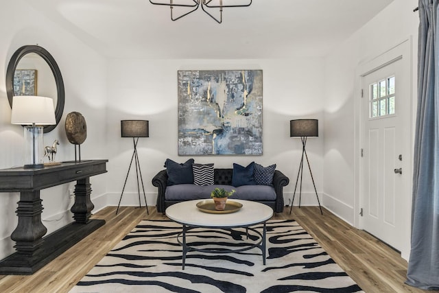 147 N Ogden Ave, Columbus, OH 43204 - interior space featuring baseboards, wood finished floors, and a notable chandelier