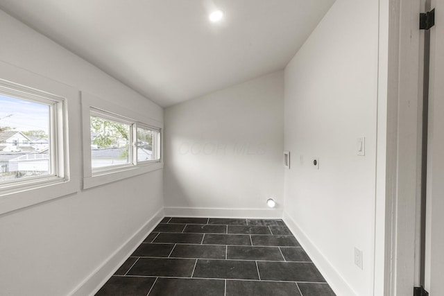147 N Ogden Ave, Columbus, OH 43204 - laundry area with dark tile patterned flooring, baseboards, laundry area, and electric dryer hookup