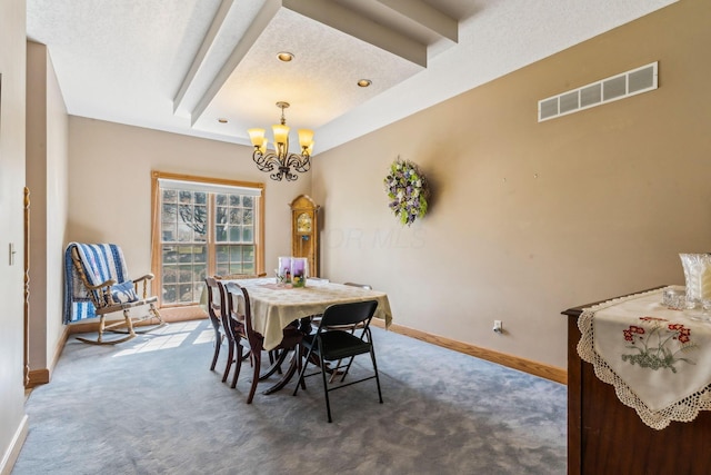 125 W Woodmere Dr, Tiffin, OH 44883 - dining space featuring a textured ceiling, visible vents, carpet floors, baseboards, and a chandelier