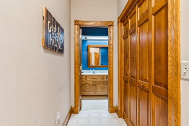125 W Woodmere Dr, Tiffin, OH 44883 - hallway with a sink, light floors, and baseboards