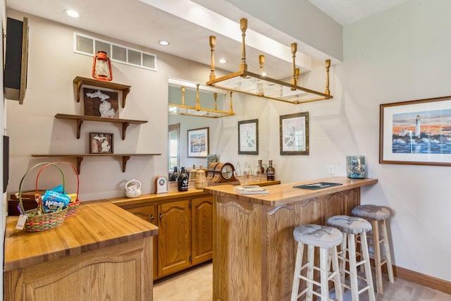 125 W Woodmere Dr, Tiffin, OH 44883 - bar featuring baseboards, indoor wet bar, recessed lighting, and visible vents