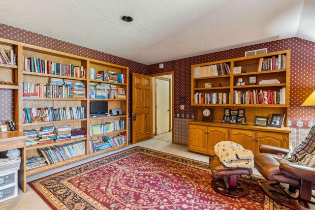 125 W Woodmere Dr, Tiffin, OH 44883 - living area with light colored carpet, a textured ceiling, and wallpapered walls