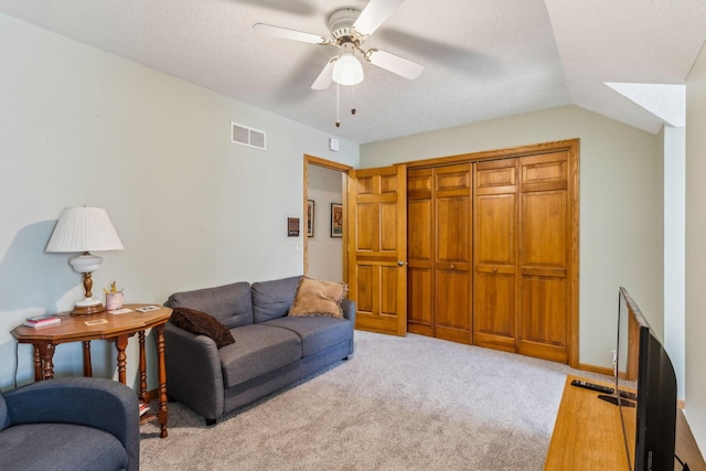 125 W Woodmere Dr, Tiffin, OH 44883 - living area with visible vents, a ceiling fan, lofted ceiling, and light carpet