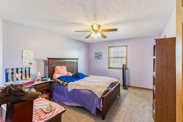 125 W Woodmere Dr, Tiffin, OH 44883 - bedroom featuring baseboards, ceiling fan, light carpet, and a textured ceiling