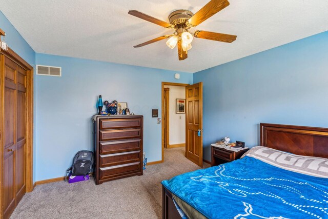 125 W Woodmere Dr, Tiffin, OH 44883 - carpeted bedroom with visible vents, baseboards, and ceiling fan