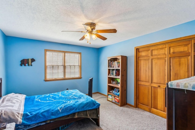 125 W Woodmere Dr, Tiffin, OH 44883 - bedroom featuring a textured ceiling, ceiling fan, light carpet, and baseboards