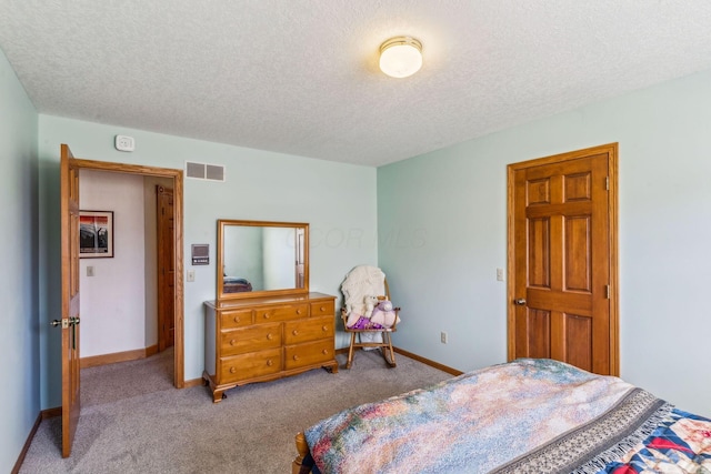 125 W Woodmere Dr, Tiffin, OH 44883 - carpeted bedroom featuring baseboards, a textured ceiling, and visible vents