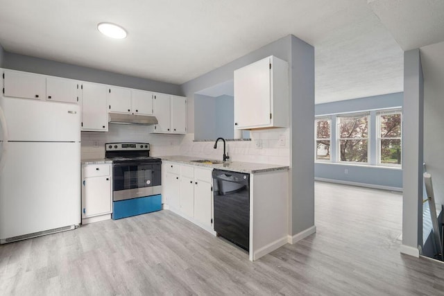 kitchen with dishwasher, stainless steel range with electric cooktop, freestanding refrigerator, light wood-style floors, and under cabinet range hood
