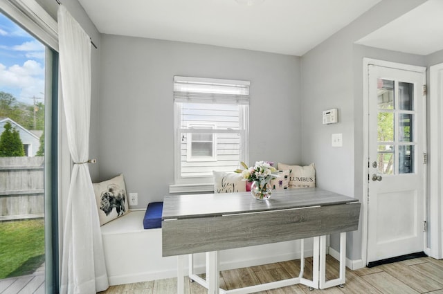 dining area featuring breakfast area, wood finished floors, and a healthy amount of sunlight