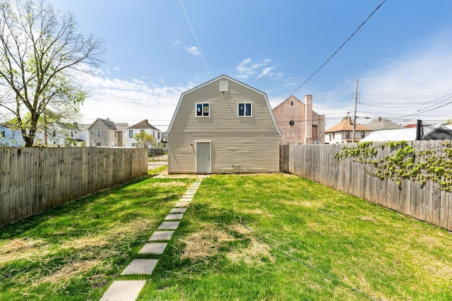 61 Dakota Ave, Columbus, OH 43222 - rear view of property featuring a fenced backyard, a yard, a gambrel roof, and a residential view