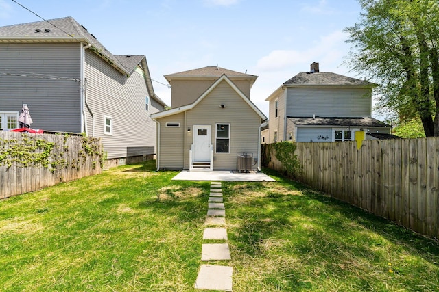 61 Dakota Ave, Columbus, OH 43222 - back of house with a yard, a patio, and a fenced backyard