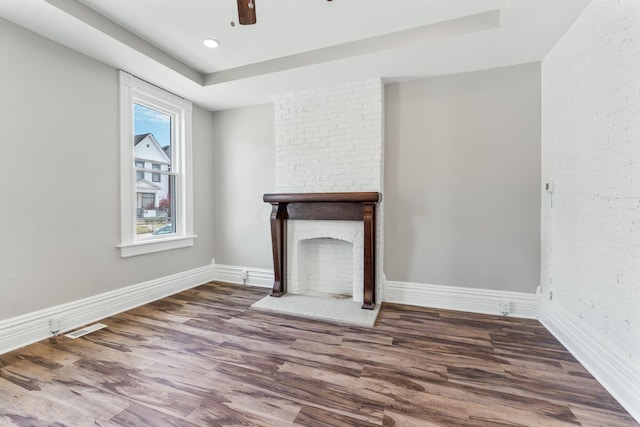 61 Dakota Ave, Columbus, OH 43222 - unfurnished living room with visible vents, a ceiling fan, baseboards, and wood finished floors