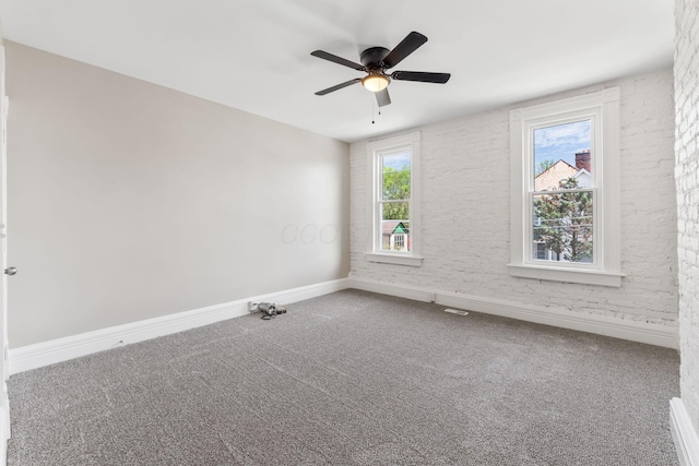 61 Dakota Ave, Columbus, OH 43222 - carpeted empty room with baseboards and a ceiling fan