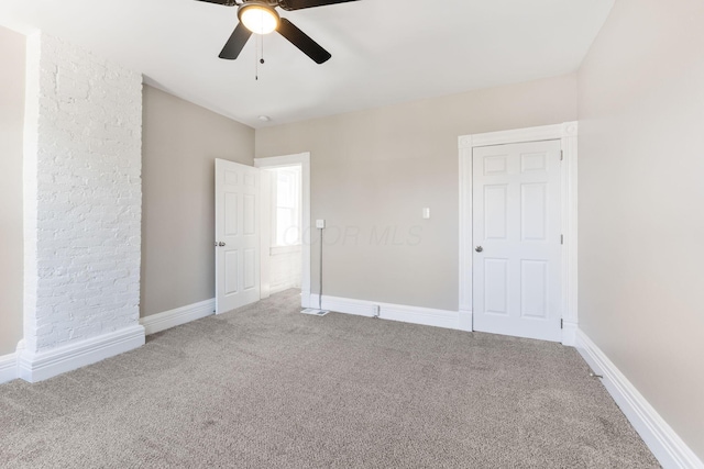61 Dakota Ave, Columbus, OH 43222 - unfurnished bedroom featuring baseboards, ceiling fan, and carpet