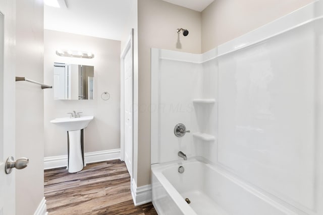 61 Dakota Ave, Columbus, OH 43222 - full bathroom featuring baseboards, shower / bath combination, and wood finished floors