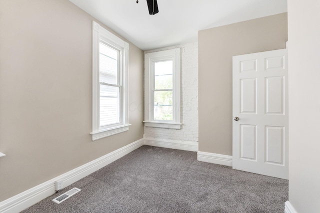 61 Dakota Ave, Columbus, OH 43222 - carpeted empty room featuring a ceiling fan, baseboards, visible vents, and a wealth of natural light