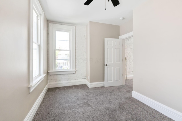 61 Dakota Ave, Columbus, OH 43222 - unfurnished room with carpet floors, baseboards, and ceiling fan