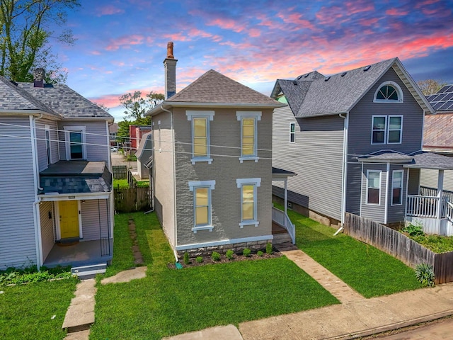 61 Dakota Ave, Columbus, OH 43222 - view of front of property with a lawn, fence, and a chimney