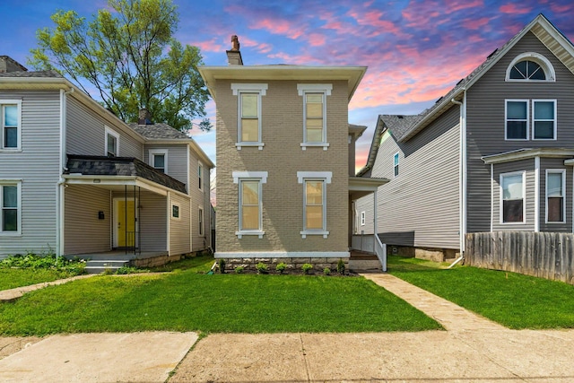 61 Dakota Ave, Columbus, OH 43222 - view of front of property featuring brick siding, a chimney, and a front lawn