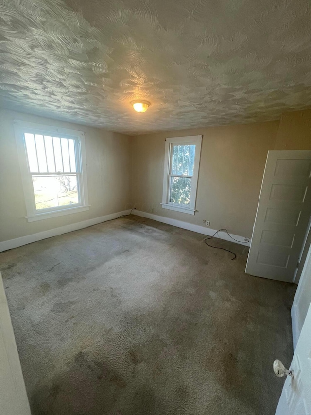 126 S Seffner Ave, Marion, OH 43302 - spare room with baseboards, carpet, and a textured ceiling