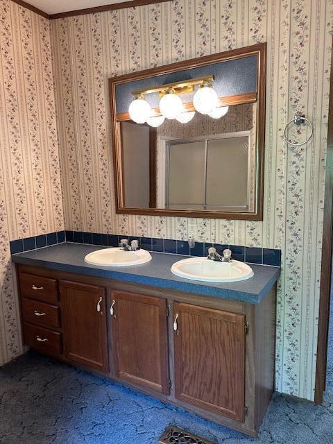 35310 Geiger Rd, Logan, OH 43138 - bathroom featuring wallpapered walls and double vanity