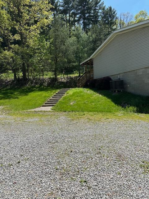 35310 Geiger Rd, Logan, OH 43138 - view of yard featuring stairway and cooling unit