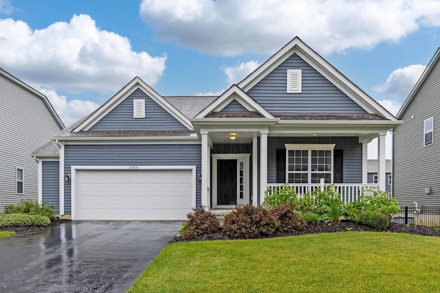 6464 Rockhold Dr, Westerville, OH 43081 - view of front facade featuring asphalt driveway, a front yard, covered porch, an attached garage, and a shingled roof