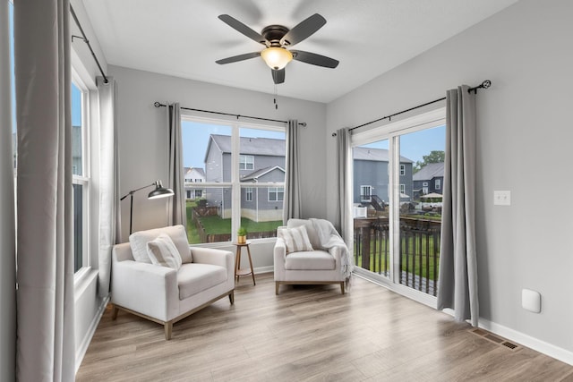 6464 Rockhold Dr, Westerville, OH 43081 - living area featuring a ceiling fan, light wood-style floors, and baseboards