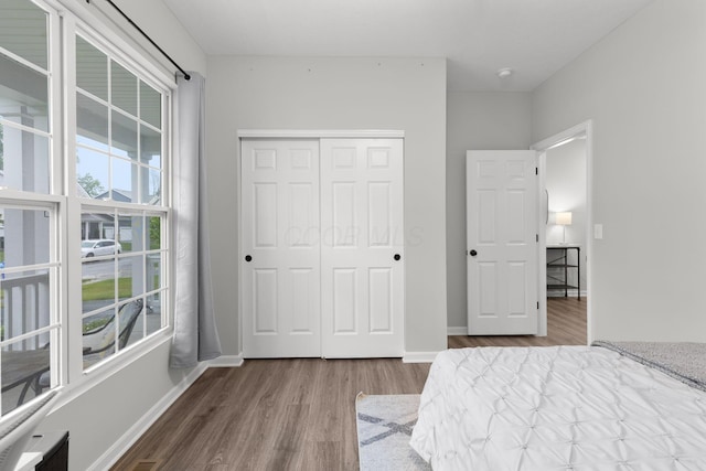 6464 Rockhold Dr, Westerville, OH 43081 - bedroom with wood finished floors, a closet, and baseboards