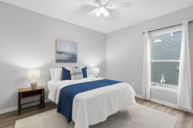 6464 Rockhold Dr, Westerville, OH 43081 - bedroom with light wood-type flooring, baseboards, and ceiling fan