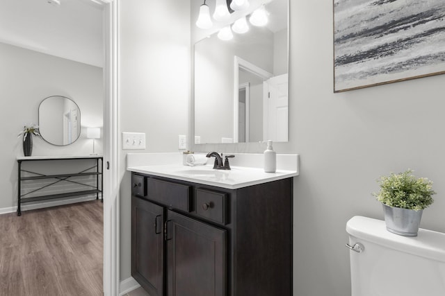 6464 Rockhold Dr, Westerville, OH 43081 - bathroom featuring vanity, toilet, and wood finished floors
