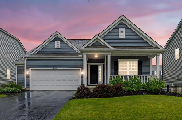6464 Rockhold Dr, Westerville, OH 43081 - view of front of house with driveway, a porch, and a garage