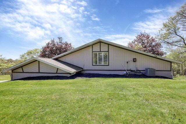 exterior space featuring a yard and central AC